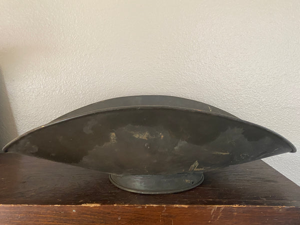 Antique scale pan, side view