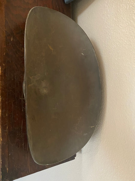 Antique scale pan, top view.