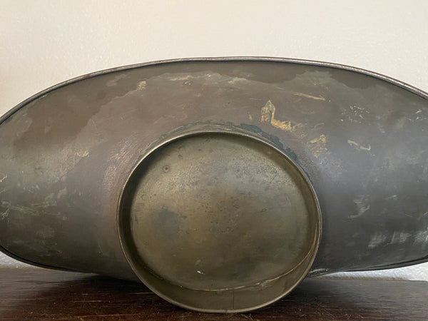 Antique scale pan, bottom.